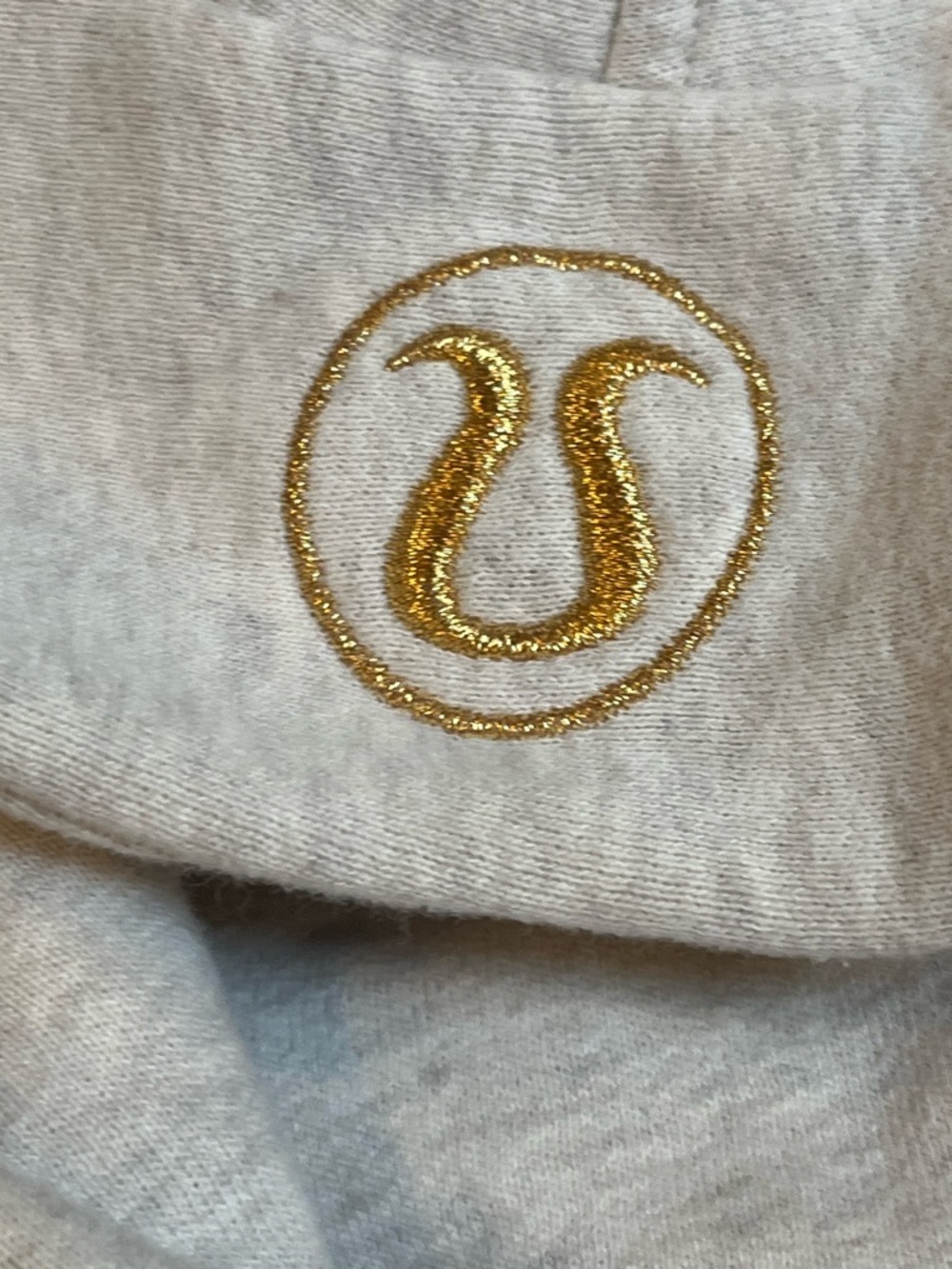 Lululemon Light Heathered Gray Half-Zip Hoodie with Gold Logo